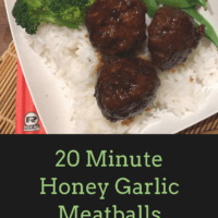 20 Minute Honey garlic meatballs in a white bowl with rice, broccoli and sugar snap peas. Spring rolls on the side.