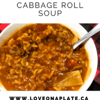 Cabbage roll soup in a white bowl on a buffalo check napkin