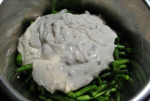 uncooked green beans and cream of mushroom soup