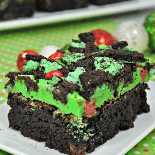 Chocolate Brownies with Green icing, chopped oreo cookie crumble and cinnamon red hots
