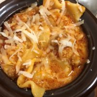 Lasagna Soup with Parmesan cheese shreds melting on top