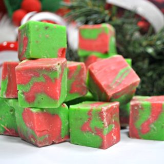 Red and Green White chocolate fudge cut into cubes and piled high.