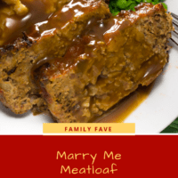 Sliced meatloaf with gravy, mashed potatoes and peas on a white plate.
