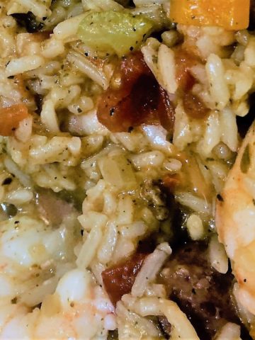 Cooked Jambalaya close up; rice, shrimp, celery, in a cajun broth