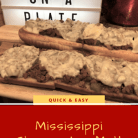 Love on a Plate Sign and Wooden cutting board with Ground Beef and Gravy smothered in cheese