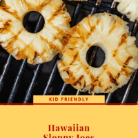 Three pieces of pineapple slices with grill marks on a bbq grill