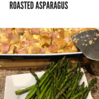 Eggs Benedict casserole in a white baking dish, and roasted asparagus on a white platter
