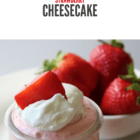 Smooth and creamy strawberry cheesecake with a graham cracker crust and topped with whipped cream and strawberries
