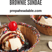 Pin image Small waffle bowl, with freshly baked brownie, topped with ice cream, fudge syrup, whipped cream and a maraschino cherry