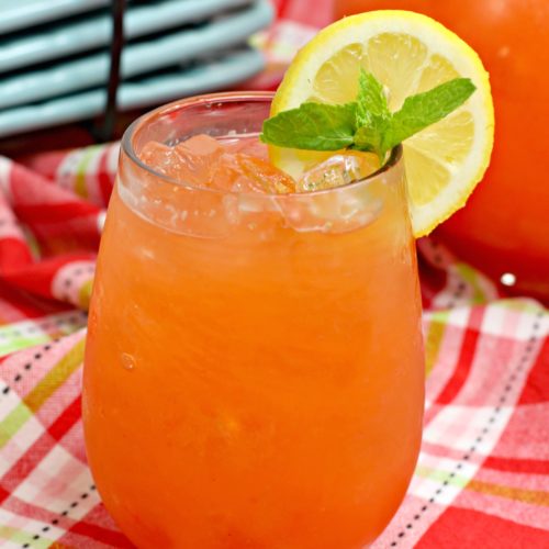 Fresh strawberry pineapple lemonade garnished with fresh mint and a lemon slice
