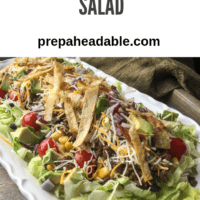 Large serving of beef taco salad on a white platter.