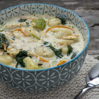Creamy chicken and gnocchi soup in a large bowl served for dinner
