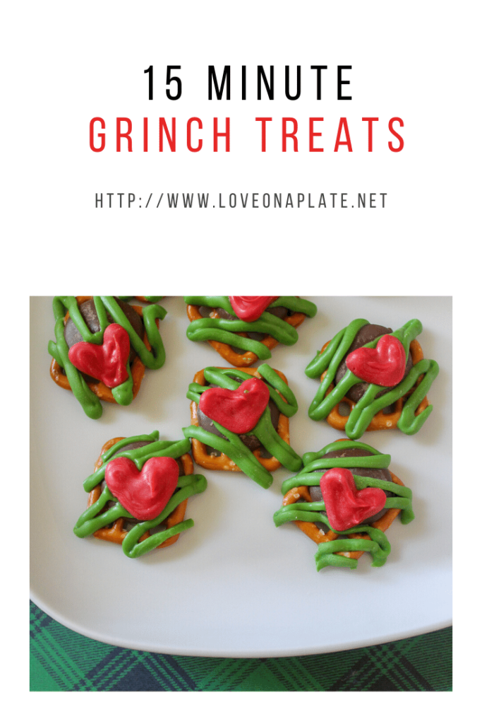 Square pretzels with chocolate pieces, green zig zag candy melt decoration and tiny red hearts