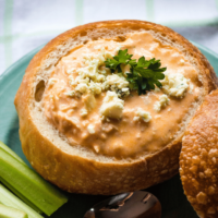 Bread Bowl filled with Buffalo Chicken soup and topped with blue cheese crumbles.