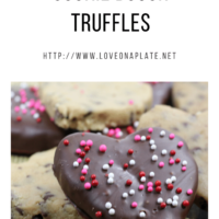 No Bake cookie dough cut into hearts, dipped in chocolate and sprikles