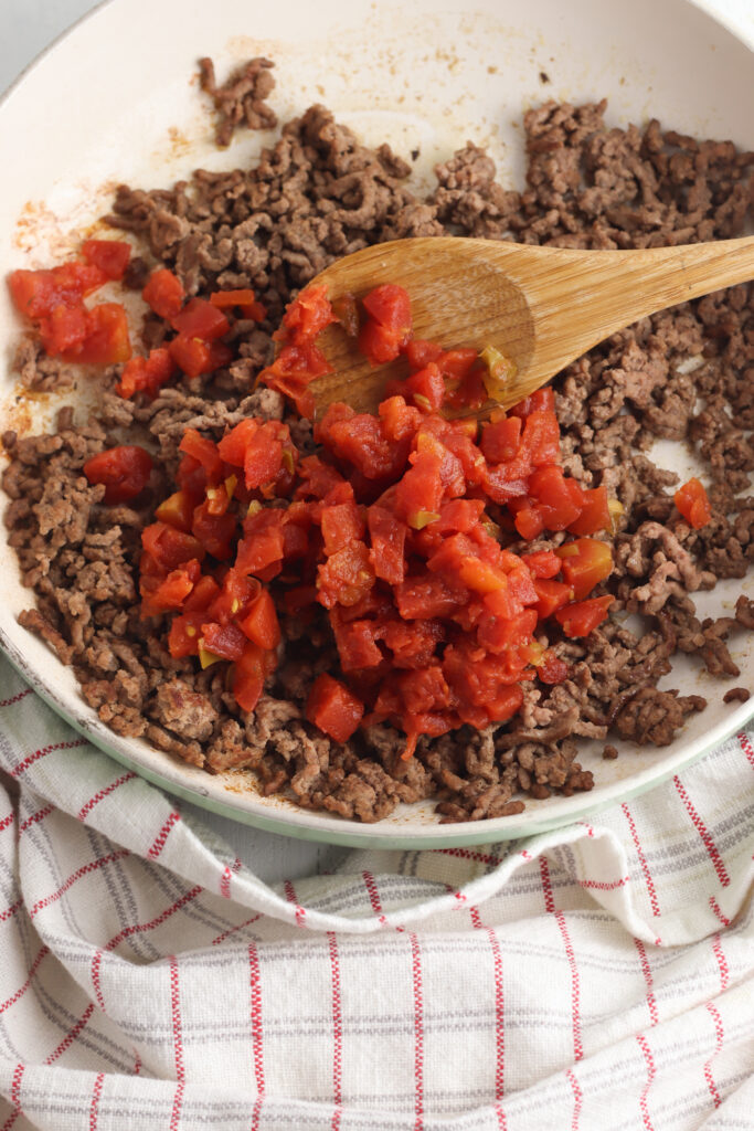 Adding canned tomatoes to ground beef