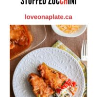 Keto friendly beef stuffed zucchini with melted cheese and enchilada sauce