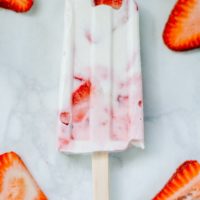Greek Yogurt popsicles studded with fresh strawberry slices.