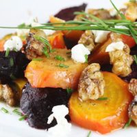 Candy Cane, Golden and Red beets sliced, topped with walnut pieces and goat cheese crumbles. Tossed in homemade vinaigrette.