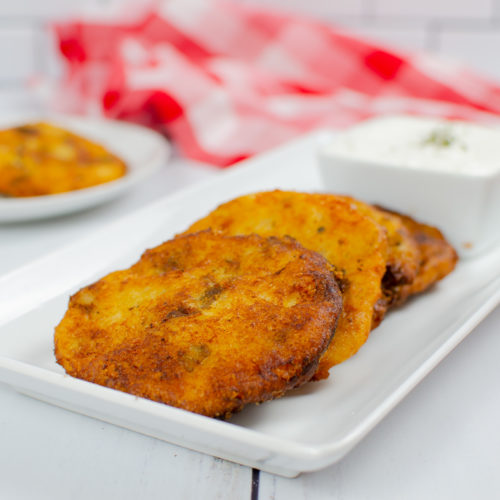 Mashed potatoes with cheese, shaped into patties and pan fried until crisp.