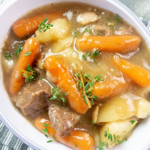 Cooked beef cubes, baby carrots, large pieces of potatoes, in a beef broth that is cooked with Guinness beer, thyme and bay leaves in the Instant Pot