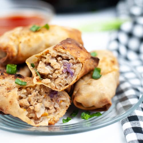 Egg roll wrappers filled with ground chicken filling and air fried until golden brown.